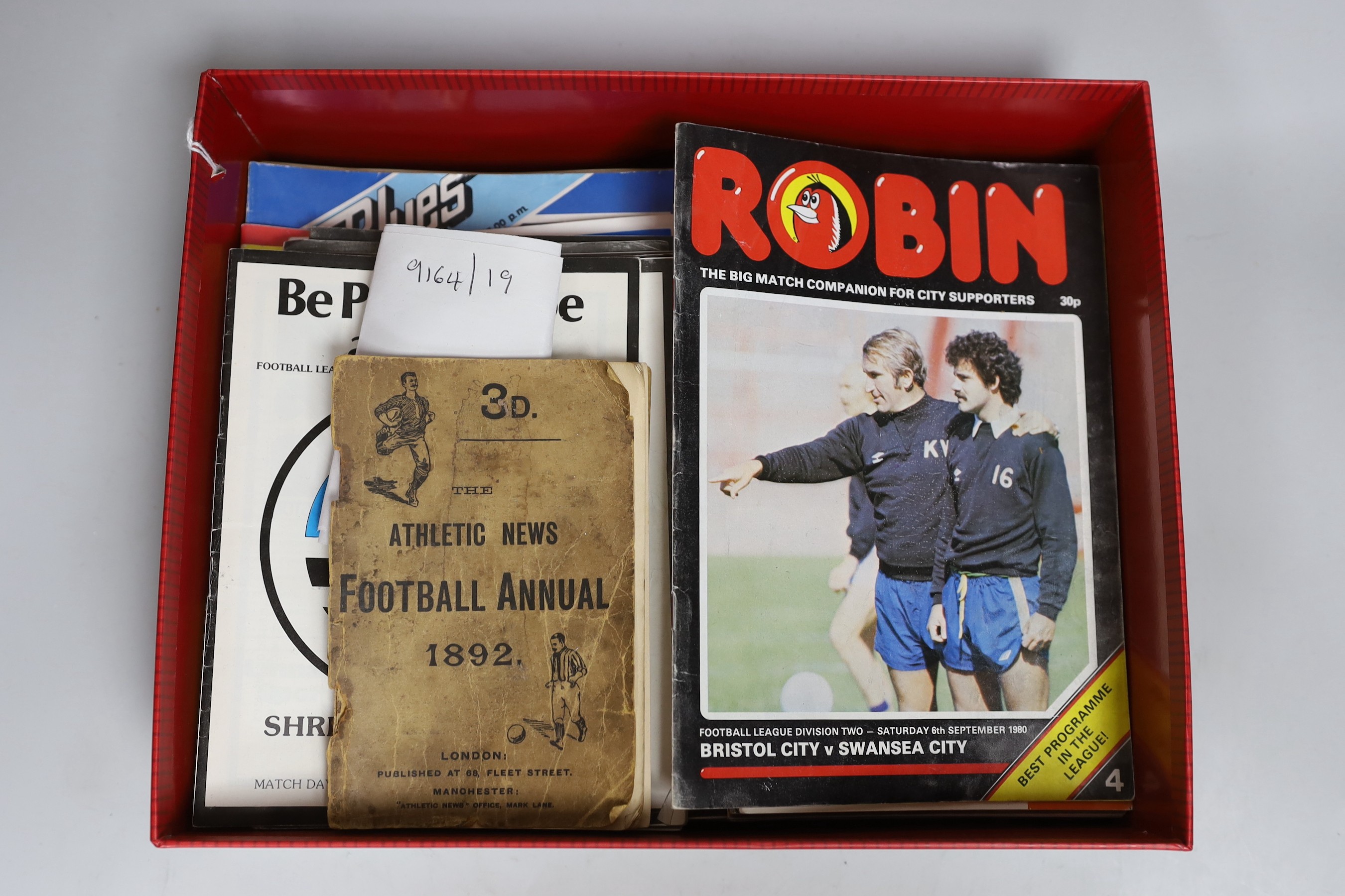 The Athletic News Football Annual 1892 and a quantity of 1980’s Swansea City football programmes.